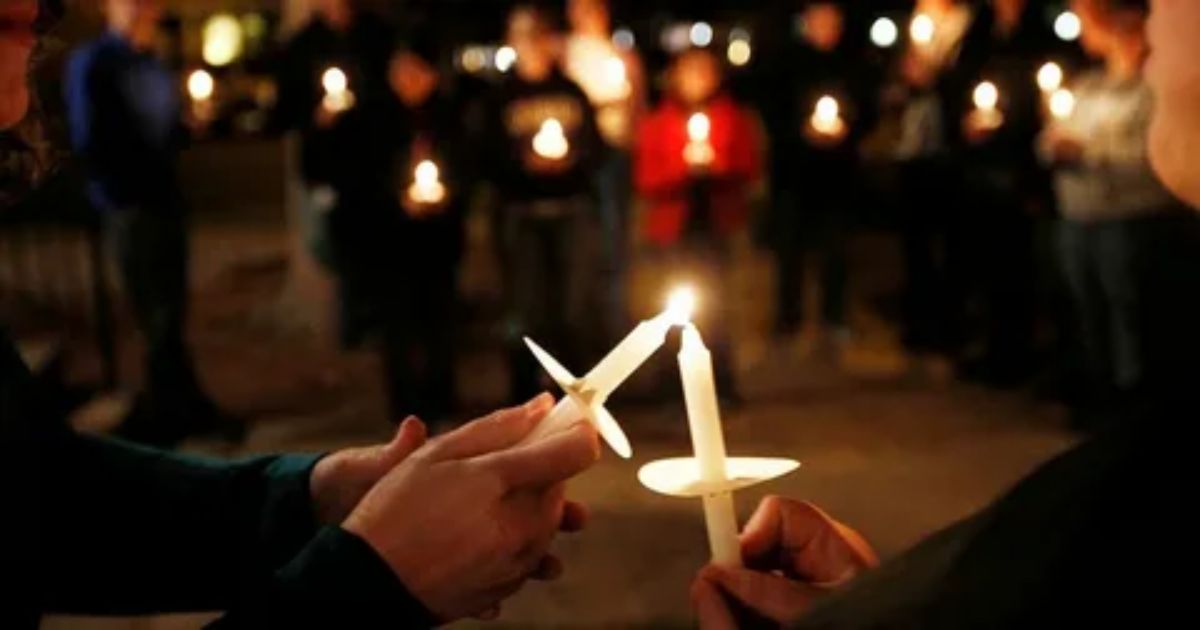 Funeral poems read during a candlelight vigil memorial service