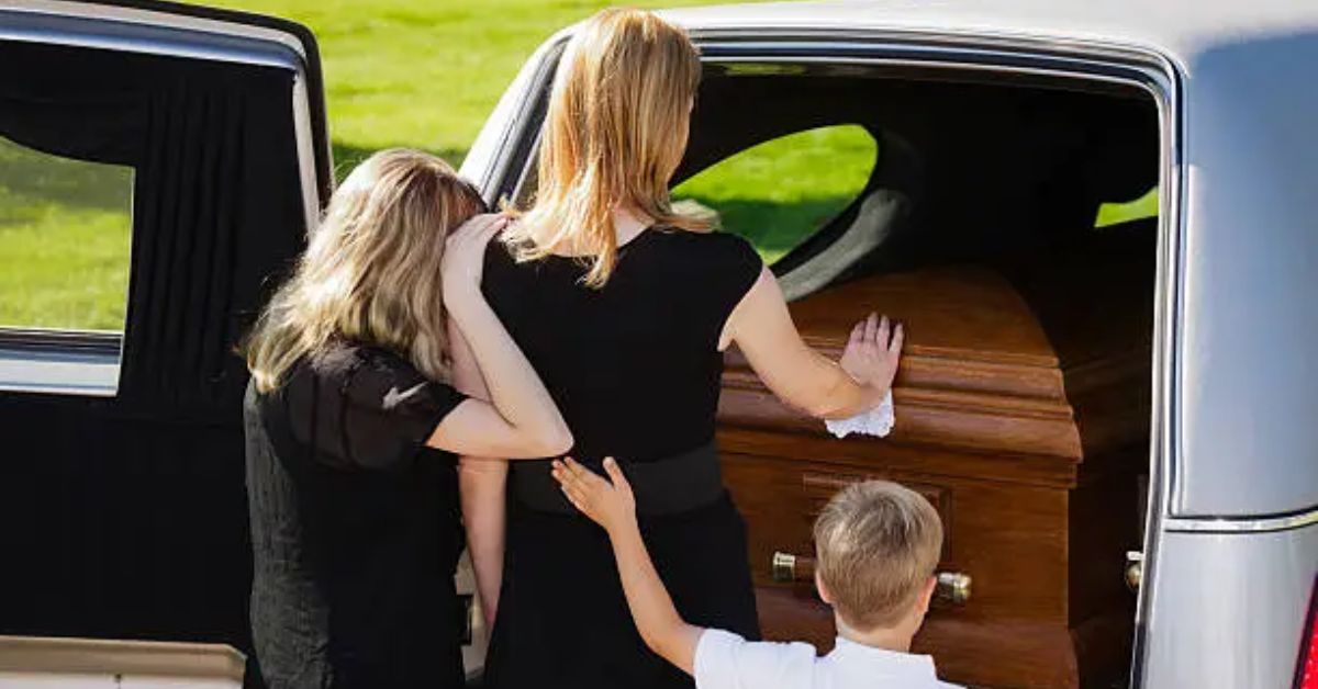 Family grieving together at a funeral, representing a poem for dad who passed away
