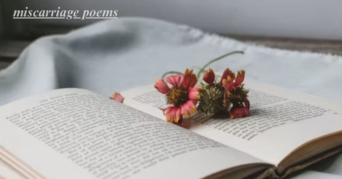 Dried flowers pressed inside an open poetry book, symbolizing miscarriage poems and quiet remembrance